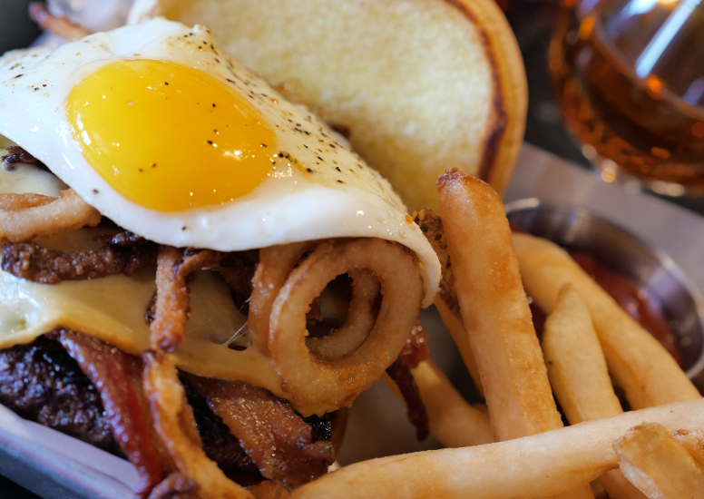 GOUDA MORNING BURGER WITH BACON, EGG, AND FRIES - AND OF COURSE A BOURBON KICKER